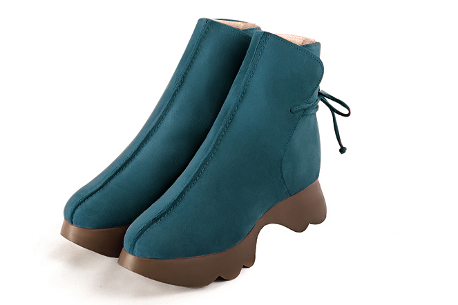 French elegance and refinement for these peacock blue dress booties with laces at the back, 
                available in many subtle leather and colour combinations. This charming ankle boot with its back lacing fits snugly around the ankle.
Its rubber sole ensures comfort and originality.
Customise or not, with your choice of materials and colours.  
                Matching clutches for parties, ceremonies and weddings.   
                You can customize these lace-up ankle boots to perfectly match your tastes or needs, and have a unique model.  
                Choice of leathers, colours, knots and heels. 
                Wide range of materials and shades carefully chosen.  
                Rich collection of flat, low, mid and high heels.  
                Small and large shoe sizes